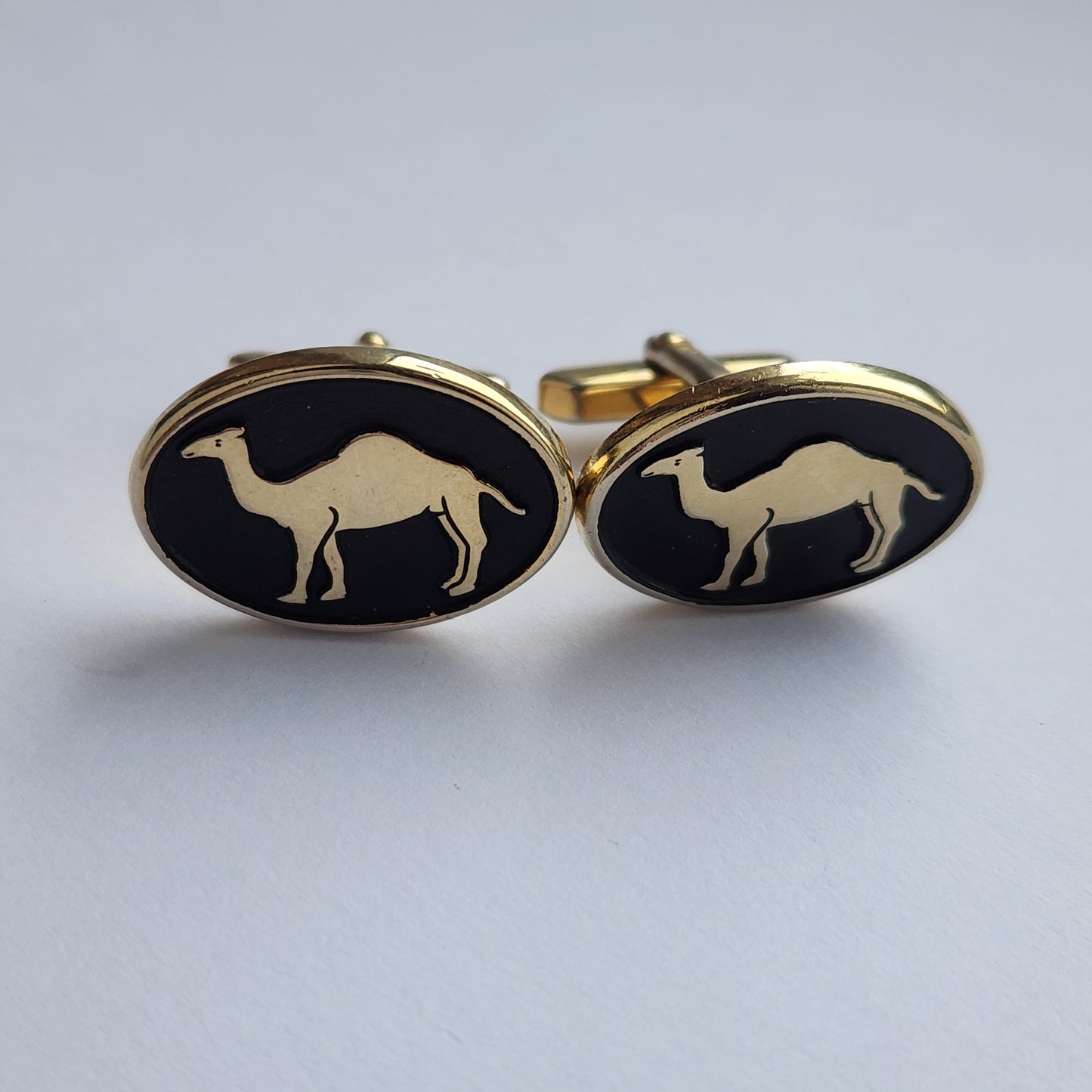 Vintage gold-tone cufflinks with black inlay camel design