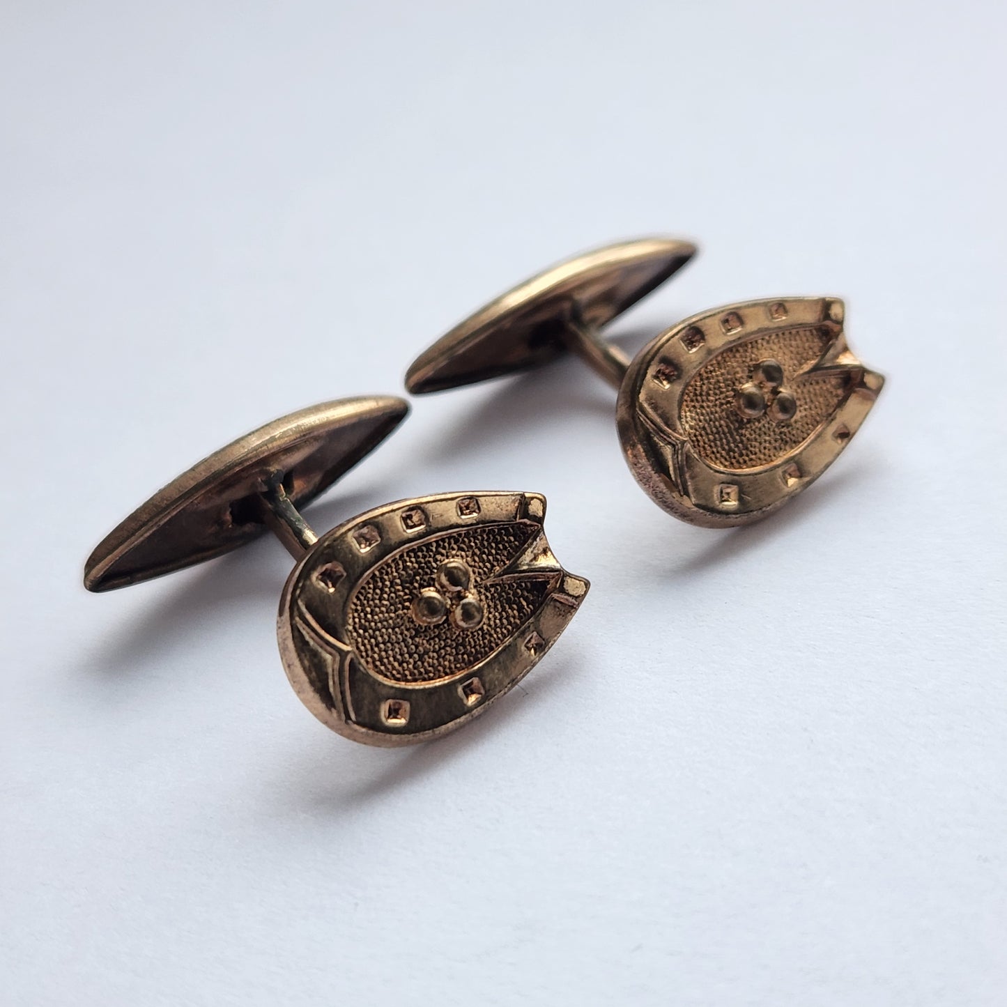 Retro gold-tone cufflinks shaped like horseshoes