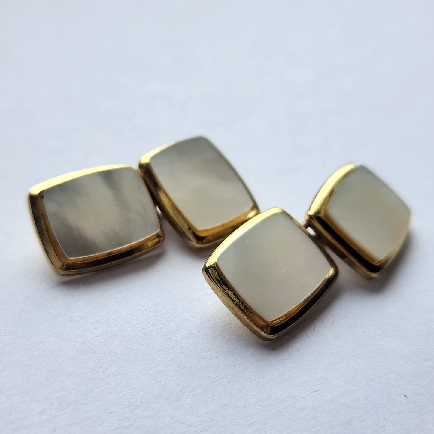 Vintage gold-tone cufflinks with mother of pearl from the front